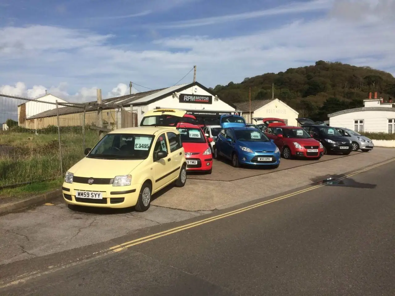Used cars lined up on the forecourt at RPM Motor Services Seaton