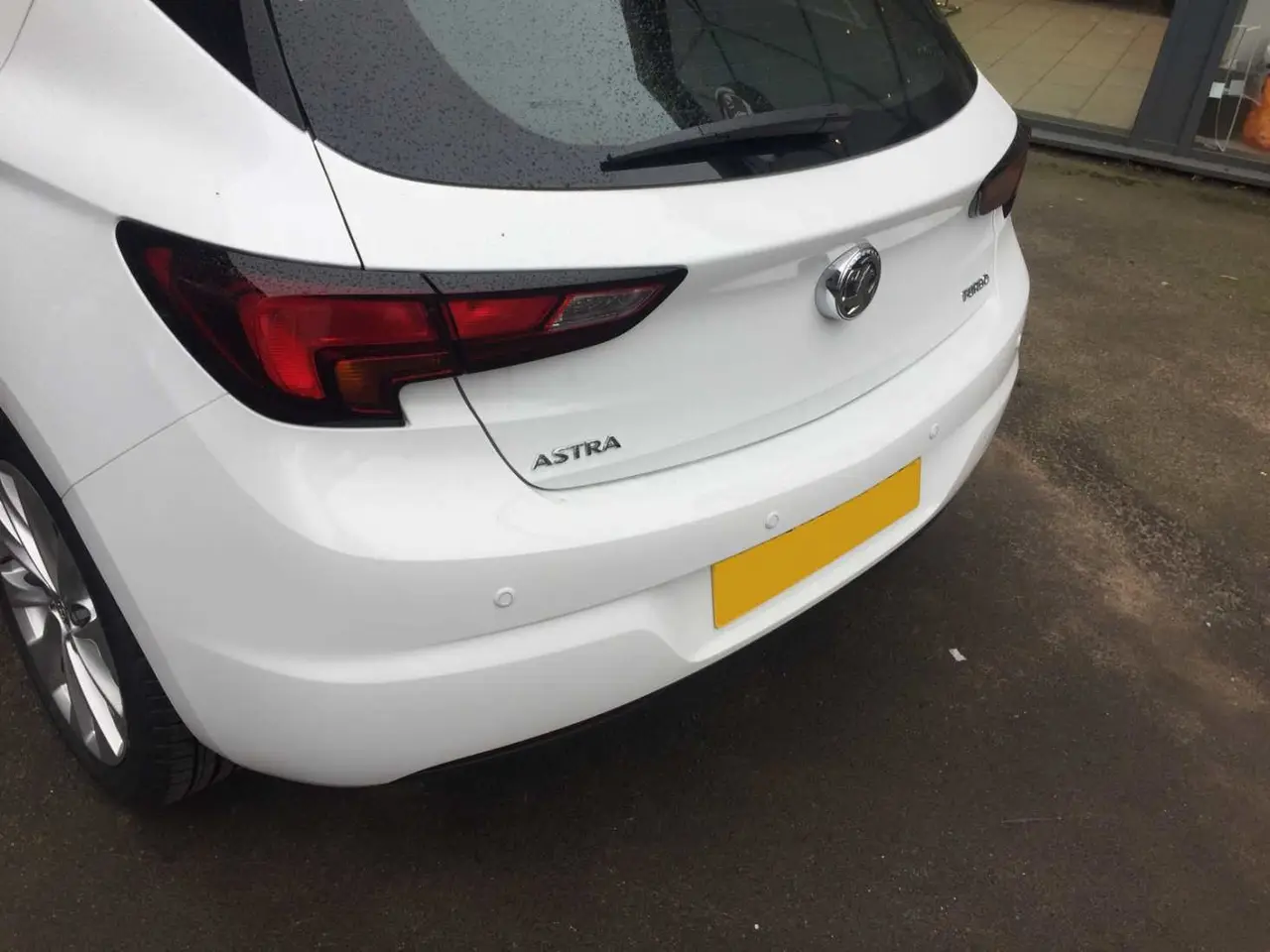 Rear parking sensors fitted to a white hatchback bumper RPM Motor Services Seaton